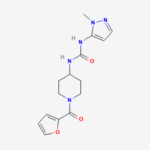 molecular formula C15H19N5O3 B6972032 1-[1-(Furan-2-carbonyl)piperidin-4-yl]-3-(2-methylpyrazol-3-yl)urea 