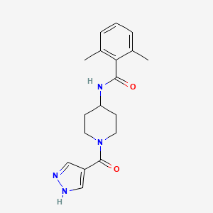 2,6-dimethyl-N-[1-(1H-pyrazole-4-carbonyl)piperidin-4-yl]benzamide