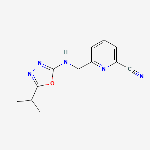 molecular formula C12H13N5O B6982229 6-[[(5-Propan-2-yl-1,3,4-oxadiazol-2-yl)amino]methyl]pyridine-2-carbonitrile 