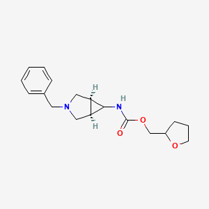 molecular formula C18H24N2O3 B7024255 oxolan-2-ylmethyl N-[(1S,5R)-3-benzyl-3-azabicyclo[3.1.0]hexan-6-yl]carbamate 