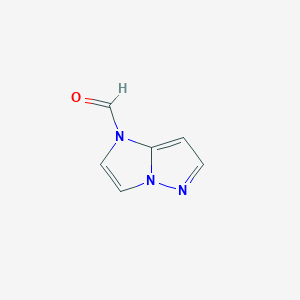 molecular formula C6H5N3O B070325 1h-Imidazo[1,2-b]pyrazole-1-carbaldehyde CAS No. 188998-04-1
