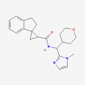 molecular formula C22H27N3O2 B7056108 N-[(1-methylimidazol-2-yl)-(oxan-4-yl)methyl]spiro[1,2-dihydroindene-3,2'-cyclopropane]-1'-carboxamide 