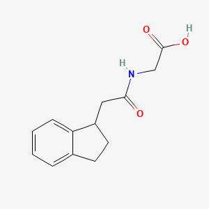 2-[[2-(2,3-dihydro-1H-inden-1-yl)acetyl]amino]acetic acid