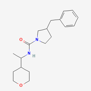 3-benzyl-N-[1-(oxan-4-yl)ethyl]pyrrolidine-1-carboxamide