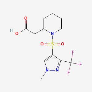 molecular formula C12H16F3N3O4S B7245630 2-[1-[1-Methyl-3-(trifluoromethyl)pyrazol-4-yl]sulfonylpiperidin-2-yl]acetic acid 