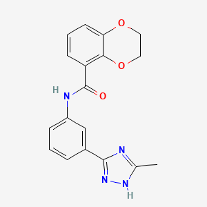 molecular formula C18H16N4O3 B7327392 N-[3-(5-methyl-1H-1,2,4-triazol-3-yl)phenyl]-2,3-dihydro-1,4-benzodioxine-5-carboxamide 