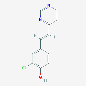 molecular formula C12H9ClN2O B7357820 2-chloro-4-[(E)-2-pyrimidin-4-ylethenyl]phenol 