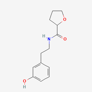 molecular formula C13H17NO3 B7410679 N-[2-(3-hydroxyphenyl)ethyl]oxolane-2-carboxamide 