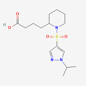 molecular formula C15H25N3O4S B7444250 4-[1-(1-Propan-2-ylpyrazol-4-yl)sulfonylpiperidin-2-yl]butanoic acid 