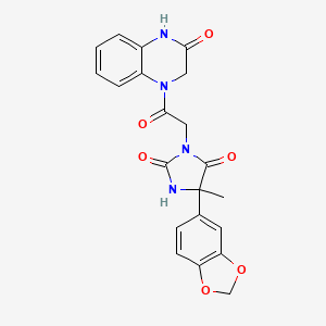 5-(1,3-Benzodioxol-5-yl)-5-methyl-3-[2-oxo-2-(3-oxo-2,4-dihydroquinoxalin-1-yl)ethyl]imidazolidine-2,4-dione