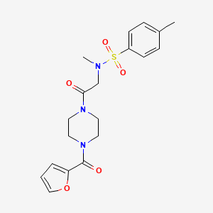 molecular formula C19H23N3O5S B7468699 N-[2-[4-(furan-2-carbonyl)piperazin-1-yl]-2-oxoethyl]-N,4-dimethylbenzenesulfonamide 