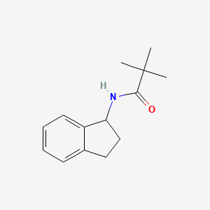 molecular formula C14H19NO B7478297 N-(2,3-dihydro-1H-inden-1-yl)-2,2-dimethylpropanamide 