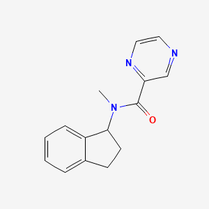 molecular formula C15H15N3O B7493156 N-(2,3-dihydro-1H-inden-1-yl)-N-methylpyrazine-2-carboxamide 