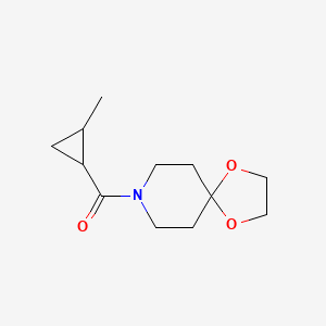 molecular formula C12H19NO3 B7494927 1,4-Dioxa-8-azaspiro[4.5]decan-8-yl-(2-methylcyclopropyl)methanone 