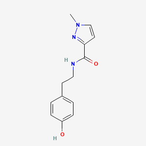 molecular formula C13H15N3O2 B7499455 N-[2-(4-hydroxyphenyl)ethyl]-1-methylpyrazole-3-carboxamide 