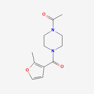 molecular formula C12H16N2O3 B7501779 1-[4-(2-Methylfuran-3-carbonyl)piperazin-1-yl]ethanone 