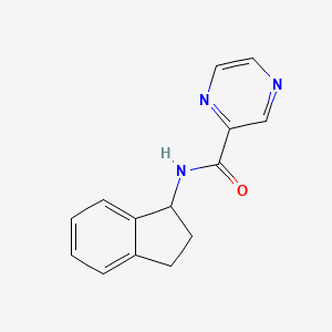 molecular formula C14H13N3O B7516477 N-(2,3-dihydro-1H-inden-1-yl)pyrazine-2-carboxamide 