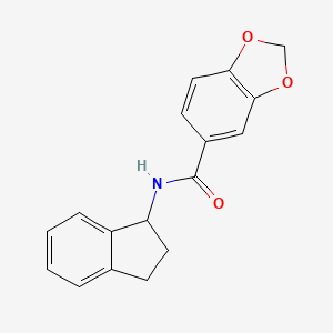 molecular formula C17H15NO3 B7546094 Benzo[1,3]dioxole-5-carboxylic Acid indan-1-ylamide 