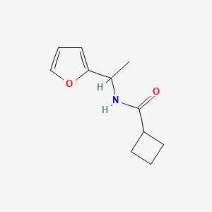 molecular formula C11H15NO2 B7564798 N-[1-(furan-2-yl)ethyl]cyclobutanecarboxamide 