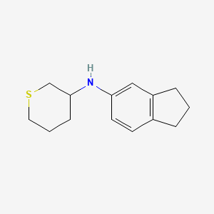 N-(2,3-dihydro-1H-inden-5-yl)thian-3-amine