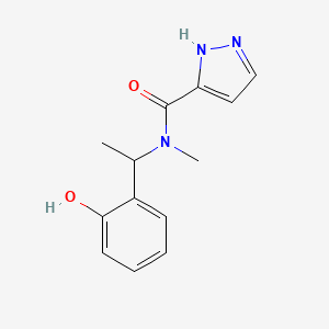 molecular formula C13H15N3O2 B7569213 N-[1-(2-hydroxyphenyl)ethyl]-N-methyl-1H-pyrazole-5-carboxamide 