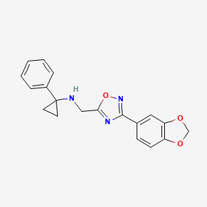 molecular formula C19H17N3O3 B7573312 N-[[3-(1,3-benzodioxol-5-yl)-1,2,4-oxadiazol-5-yl]methyl]-1-phenylcyclopropan-1-amine 