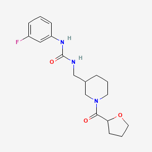 molecular formula C18H24FN3O3 B7573686 1-(3-Fluorophenyl)-3-[[1-(oxolane-2-carbonyl)piperidin-3-yl]methyl]urea 