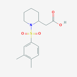 molecular formula C15H21NO4S B7576310 2-[1-(3,4-Dimethylphenyl)sulfonylpiperidin-2-yl]acetic acid 