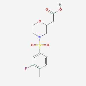 molecular formula C13H16FNO5S B7579869 2-[4-(3-Fluoro-4-methylphenyl)sulfonylmorpholin-2-yl]acetic acid 