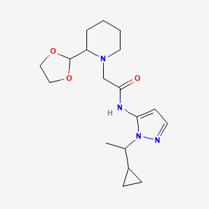 molecular formula C18H28N4O3 B7592866 N-[2-(1-cyclopropylethyl)pyrazol-3-yl]-2-[2-(1,3-dioxolan-2-yl)piperidin-1-yl]acetamide 