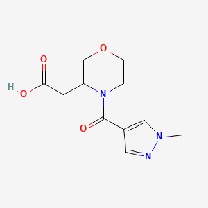 molecular formula C11H15N3O4 B7601968 2-[4-(1-Methylpyrazole-4-carbonyl)morpholin-3-yl]acetic acid 