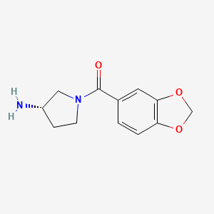 [(3S)-3-aminopyrrolidin-1-yl]-(1,3-benzodioxol-5-yl)methanone