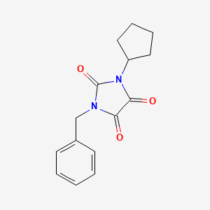 molecular formula C15H16N2O3 B7616621 1-Benzyl-3-cyclopentylimidazolidine-2,4,5-trione 