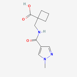 molecular formula C11H15N3O3 B7617386 1-[[(1-Methylpyrazole-4-carbonyl)amino]methyl]cyclobutane-1-carboxylic acid 