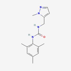 molecular formula C15H20N4O B7623525 1-[(2-Methylpyrazol-3-yl)methyl]-3-(2,4,6-trimethylphenyl)urea 