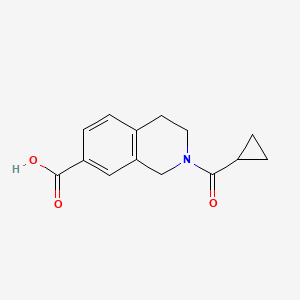 molecular formula C14H15NO3 B7627819 2-(cyclopropanecarbonyl)-3,4-dihydro-1H-isoquinoline-7-carboxylic acid 