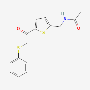 molecular formula C15H15NO2S2 B7629023 N-[[5-(2-phenylsulfanylacetyl)thiophen-2-yl]methyl]acetamide 