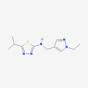 molecular formula C11H17N5S B7641711 N-[(1-ethylpyrazol-4-yl)methyl]-5-propan-2-yl-1,3,4-thiadiazol-2-amine 