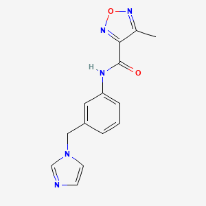 molecular formula C14H13N5O2 B7644670 N-[3-(imidazol-1-ylmethyl)phenyl]-4-methyl-1,2,5-oxadiazole-3-carboxamide 