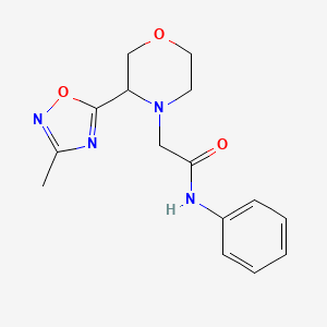 molecular formula C15H18N4O3 B7649874 2-[3-(3-methyl-1,2,4-oxadiazol-5-yl)morpholin-4-yl]-N-phenylacetamide 