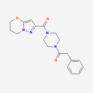 molecular formula C19H22N4O3 B7651072 1-[4-(6,7-dihydro-5H-pyrazolo[5,1-b][1,3]oxazine-2-carbonyl)piperazin-1-yl]-2-phenylethanone 