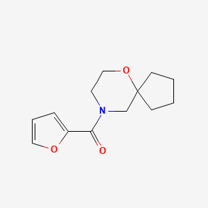 molecular formula C13H17NO3 B7652781 Furan-2-yl(6-oxa-9-azaspiro[4.5]decan-9-yl)methanone 