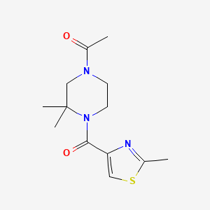 molecular formula C13H19N3O2S B7653455 1-[3,3-Dimethyl-4-(2-methyl-1,3-thiazole-4-carbonyl)piperazin-1-yl]ethanone 