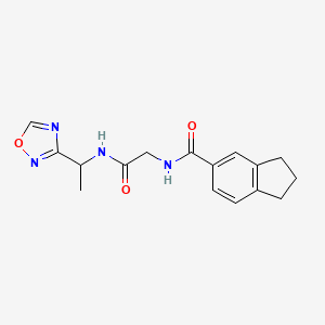 molecular formula C16H18N4O3 B7659592 N-[2-[1-(1,2,4-oxadiazol-3-yl)ethylamino]-2-oxoethyl]-2,3-dihydro-1H-indene-5-carboxamide 