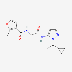 N-[2-[[2-(1-cyclopropylethyl)pyrazol-3-yl]amino]-2-oxoethyl]-2-methylfuran-3-carboxamide