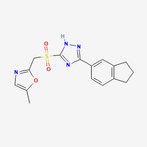 molecular formula C16H16N4O3S B7679645 2-[[3-(2,3-dihydro-1H-inden-5-yl)-1H-1,2,4-triazol-5-yl]sulfonylmethyl]-5-methyl-1,3-oxazole 