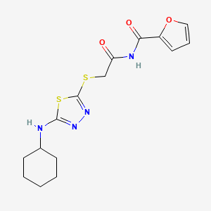 molecular formula C15H18N4O3S2 B7680442 N-[2-[[5-(cyclohexylamino)-1,3,4-thiadiazol-2-yl]sulfanyl]acetyl]furan-2-carboxamide 