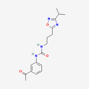 molecular formula C17H22N4O3 B7681448 1-(3-Acetylphenyl)-3-[3-(3-propan-2-yl-1,2,4-oxadiazol-5-yl)propyl]urea 