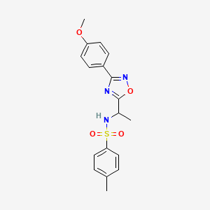 molecular formula C18H19N3O4S B7715325 N-(1-(3-(4-methoxyphenyl)-1,2,4-oxadiazol-5-yl)ethyl)-4-methylbenzenesulfonamide 