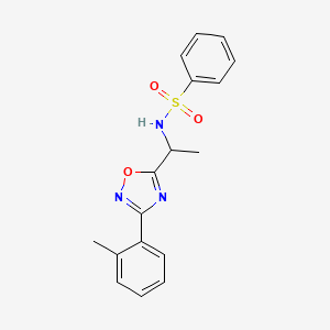 molecular formula C17H17N3O3S B7715774 N-(1-(3-(o-tolyl)-1,2,4-oxadiazol-5-yl)ethyl)benzenesulfonamide 